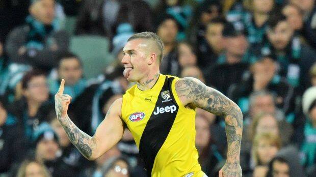 A coin toss could decide on a potential AFL grand final jumper clash between Richmond and Adelaide. Photo: AAP
