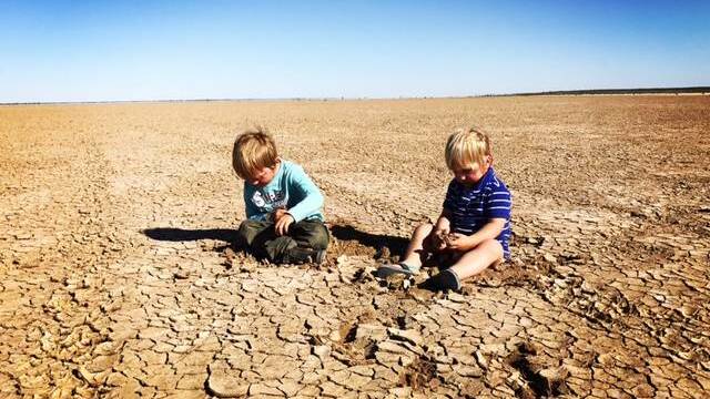  Finn and Archie Siemer on Yantara Lake, Coally Station north of Broken Hill, that went dry Christmas 2015. Many farms across NSW - not just the far west - are struggling with drought. Photo by Tennille Siemer.

