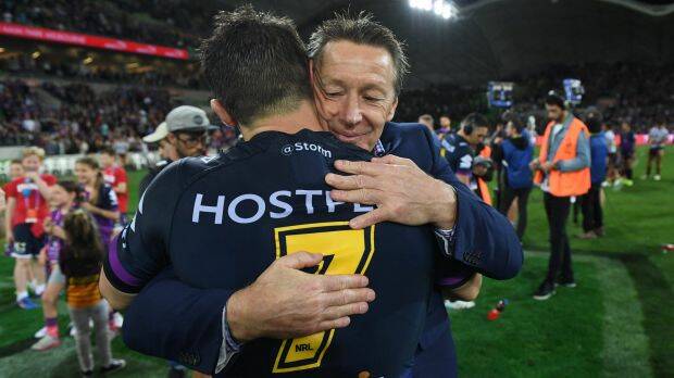 Thanks for the memories: Storm coach Craig Bellamy (right) and Cooper Cronk share a moment after the preliminary final victory over Brisbane. Photo: AAP