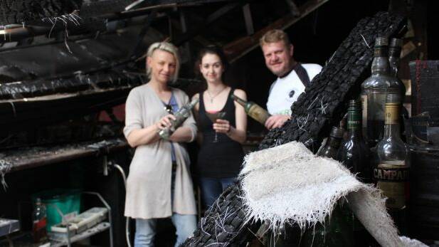 Owner Kate Richards, manager Courtney Parker and owner Allen St James inside the Armidale Club in late 2016 after it was destroyed by fire. Photo: Madeline Link