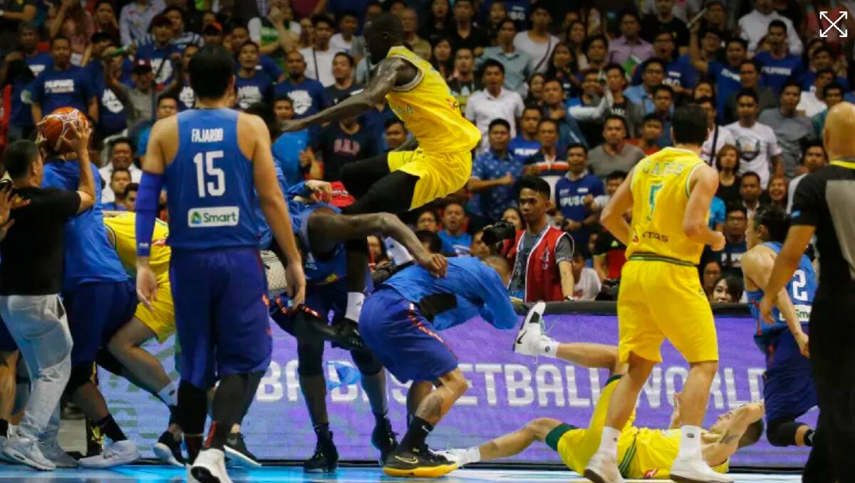 Boomers player Thon Maker tries to high kick a Philippines player. Photo: AP