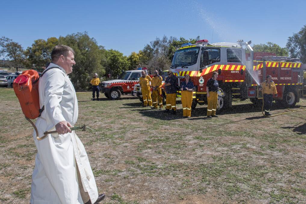 Back atcha: The Rural Fire Service volunteers gave back a blessing of their own. Photo: Peter Hardin 160918PHA026