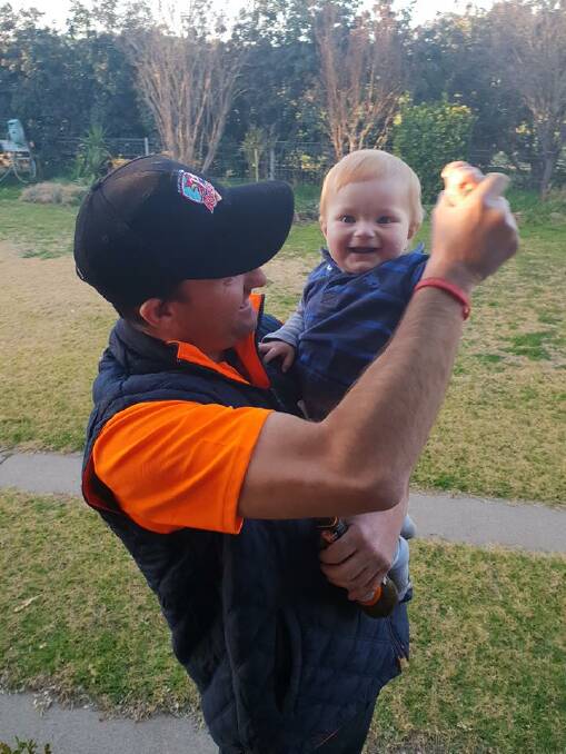 CHEERING: Lad Jones with 10-month-old Jesse, who has cystic fibrosis, straight after they heard the announcement.