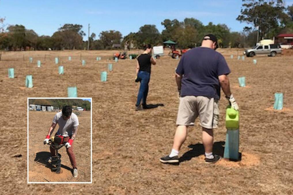 GROUNDED: The team of helpers hard at work on planting day, during which they put 38 native species into the ground at the Moore Creek property.