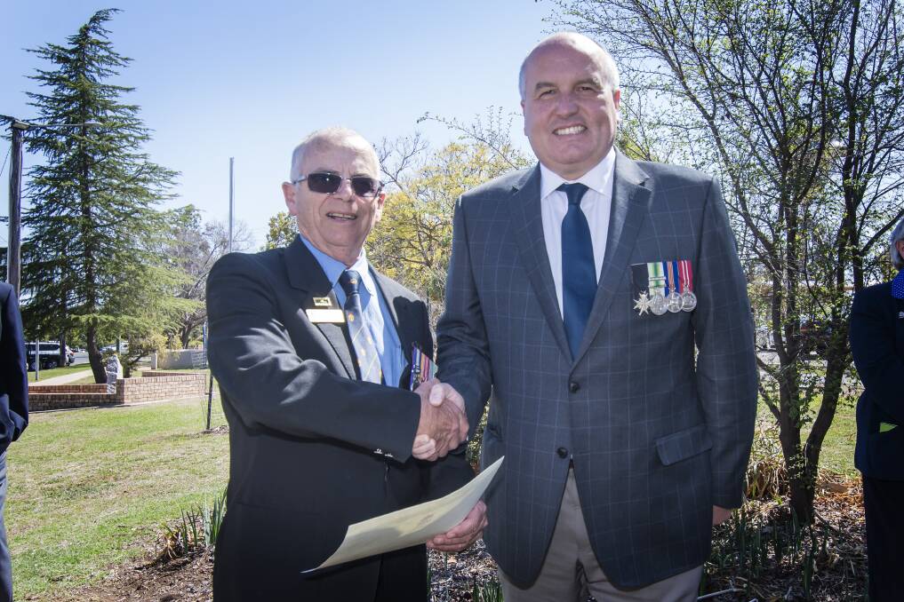 THANKS: Tamworth Legacy president-secretary and Vietnam War veteran Greg Roese, with NSW Veterans Affairs Minister David Elliott. Photo: Peter Hardin 140918PHB008