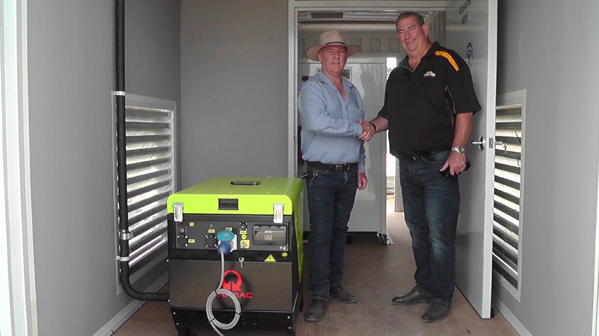 GENEROSITY: Shire mayor Andrew Hope thanks Trevor Oldfield for the unit, housed in a soundproof container.