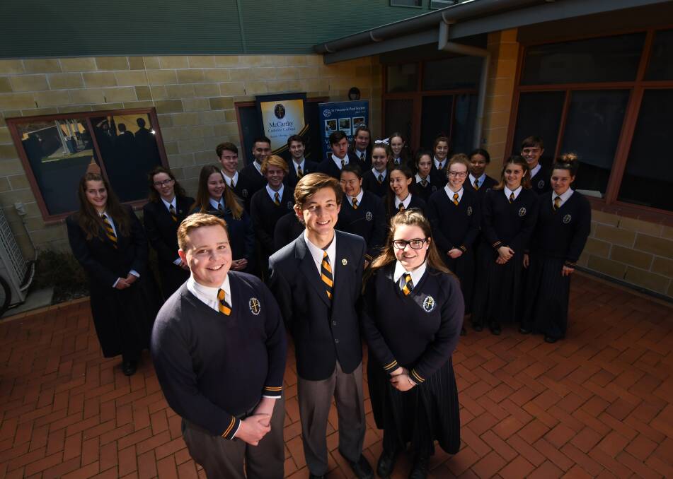 MISSION: Cameron Martin, Tom Rindo, Alice Bruyn and their McCarthy Catholic College peers. They aim to raise $20,000 in drought funds. Photo: Gareth Gardner 050918GGA02