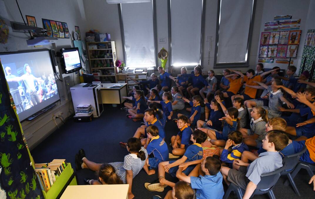 TUNED IN: Years 5 and 6 students at Tamworth Public School get involved in the activities of Music: Count Us In this morning. Photo: Gareth Gardner 021117GGB004