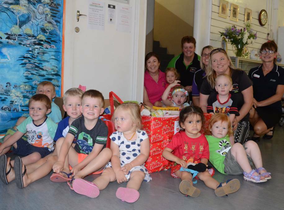 BELOW: Inverell and District Family Day Care hands over the boxes of goodies to the Salvation Army.