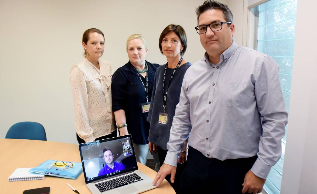 LARGELY BAD: Katrina Wakely, Alex Little, Rebecca Wolfgang, Luke Wakely and - on the screen - Rhys Dintino are members of a research team who've been studying NDIS providers' experience in rural and remote areas. 