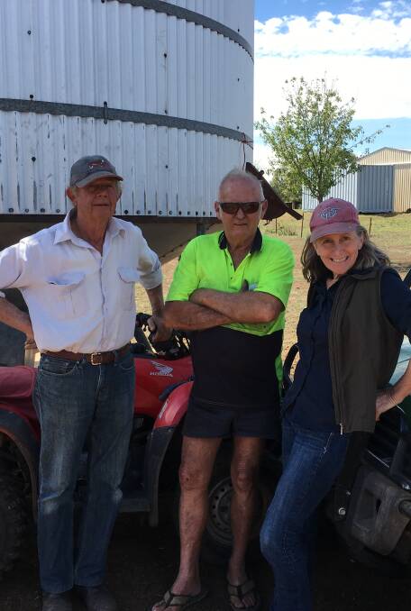Tony and Jacqui Hann flank truck driver Ken. They have been feeding pellets and Anipro, plus some kurrajong branches.