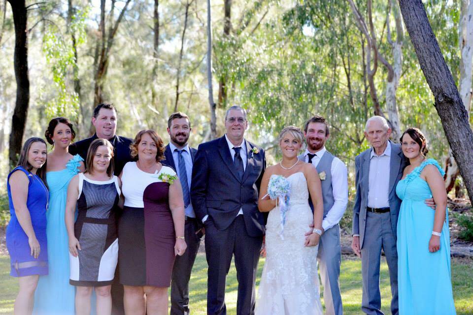 MUCH-LOVED DAD AND POPPY: Terry Lloyd, middle, eight months before his disappearance, with his family at his daughter Kaylah's wedding to Craig.