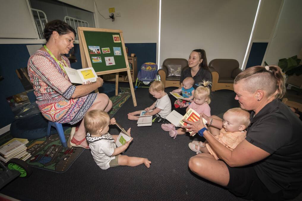 PAGE-TURNER: Children's services librarian Kelly Makepeace reads to the littlies on World Read Aloud Day. Photo: Peter Hardin 010219PHA029