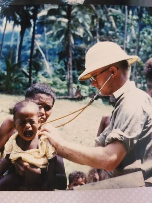 Dr Peter Vines examining a patient in PNG in 1959.