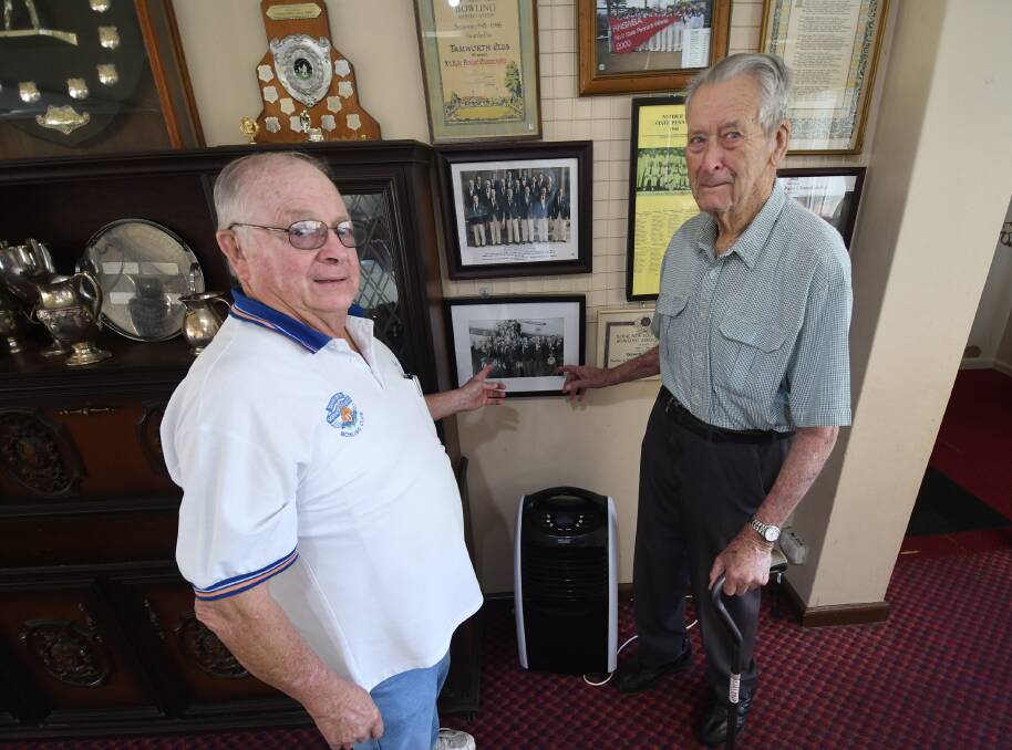 HISTORY: Tamworth City Bowling Club president Kerry Walden and life member Nevell McDonald with some of the memorabilia dinner guests will be able to peruse. Photo: Gareth Gardner 160419GGB08