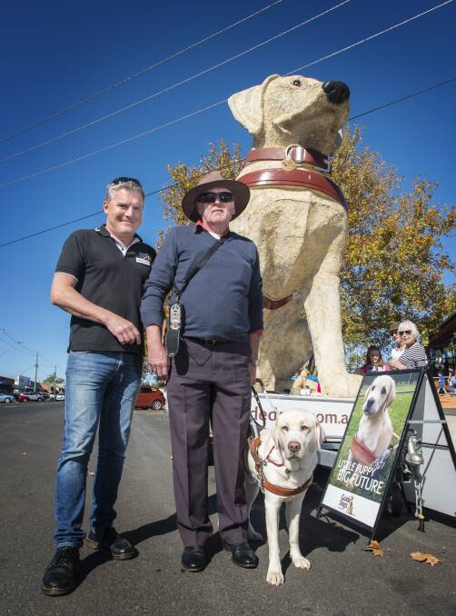 SYMBOL OF FREEDOM: Jeremy Hill, Phillip Tilley, Nelson the guide dog and Gulliver the mascot. Photo: Peter Hardin 250517PHC014