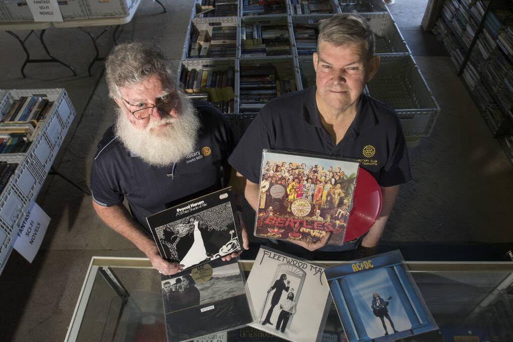 Worth a whirl: Rotary district governor Phil Hafey and Rotary Club of Tamworth community services co-ordinator John Nash with some of the albums on offer. Photo: Peter Hardin 110919PHC016