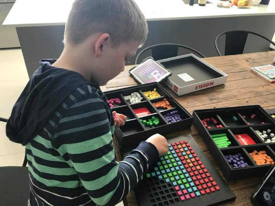 CODE TO CREATE: Tamworth Tech Camper Kalan Perkins uses a Bloxels kit to create his own video game, one example of the activities eligible for the Creative Kids vouchers.