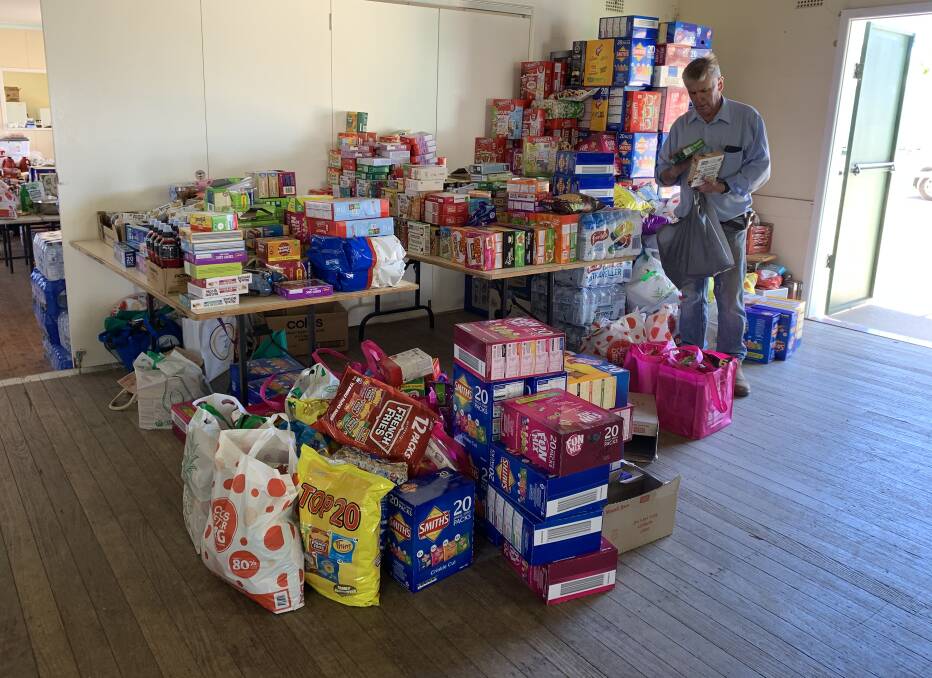STOCKING UP: Volunteers have been donating, buying, delivering and sorting food to fuel the firefighters. Photo: Tianna Milovanovic
