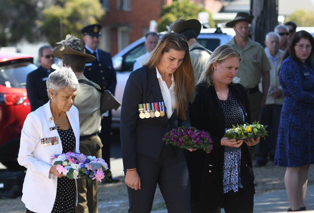 Breeanna Till and Victoria Hopkins, both war widows, unveiled the dedication plaque and laid wreaths. They are pictured with Tamworth RSL Sub-branch volunteer Bev Belt. Photos: Gareth Gardner 050418GGC019