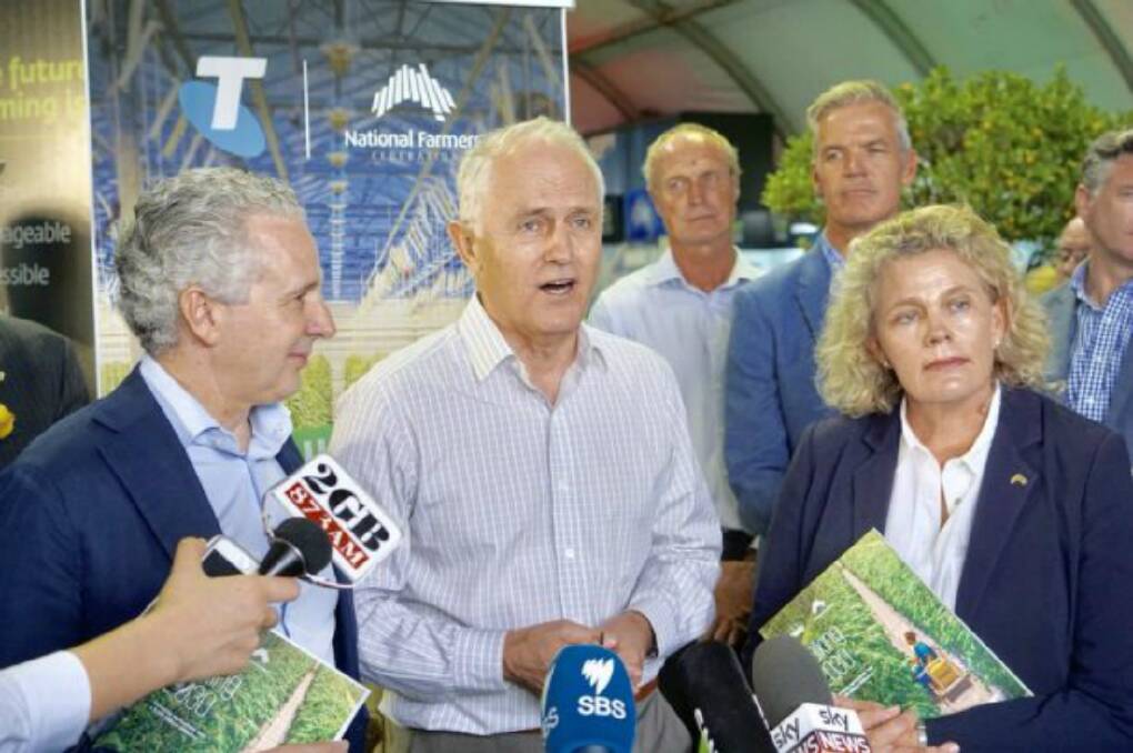 TALKING POINTS: Telstra chief executive Andrew Penn, then-PM Malcolm Turnbull and National Farmers' Federation president Fiona Simson at the Sydney Royal Easter Show.