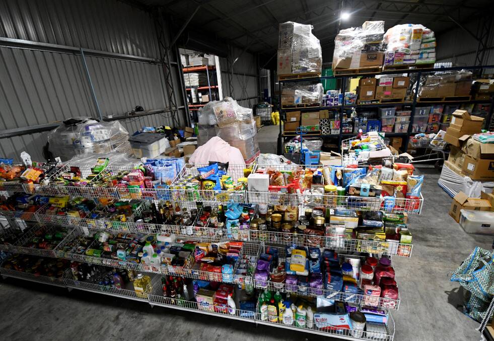 SUPPLIES: The food pantry is set out like a store, carrying everything from dog food to deodorant. People affected by drought can go in a do their shopping, free of charge. Photo: Gareth Gardner 071118GGA01