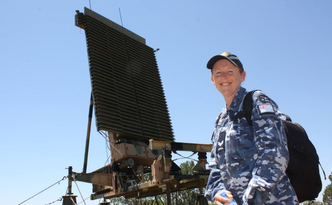 Mission complete: An RAAF member pictured with the Lockheed Martin Tactical Air Defence Radar System near Gunnedah, which was switched off on Friday after 15 months monitoring the skies for the flight training school.