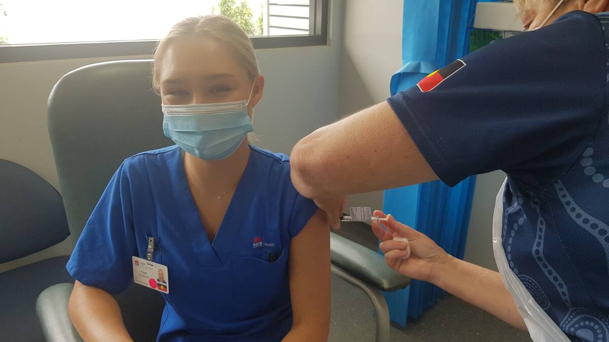 HEAVEN SENT: Angel St John became the first Hunter health worker vaccinated for COVID-19 in Sydney yesterday. 