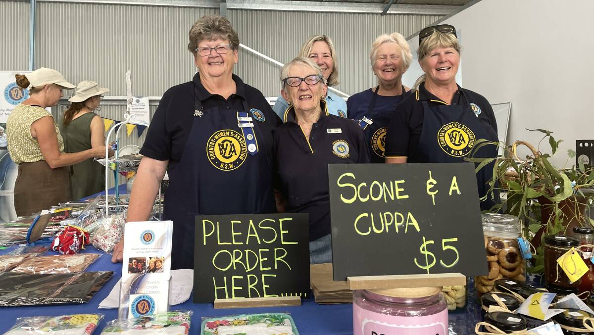 CWA Armidale branch president Llani Pevitt and members with some of their homemade scones. The ladies are also selling pickles, jams and sauces they made especially for the show.