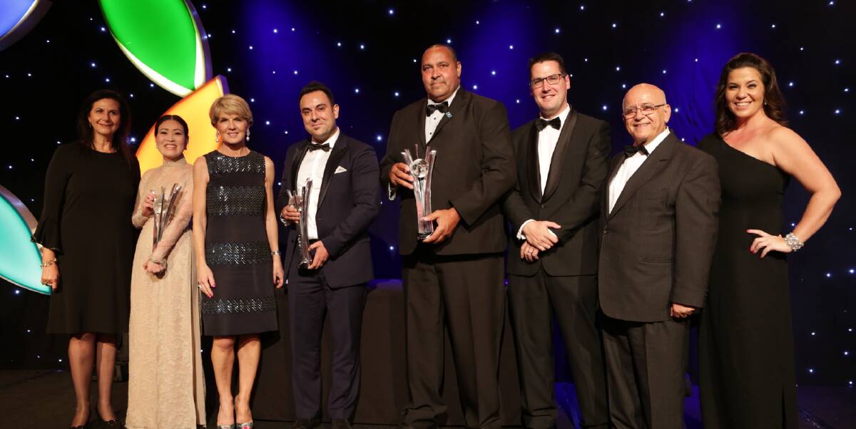RECOGNITION: Warialda Engineering and Welding founder Mick Davis, centre,  with his win at the Ethnic Business Awards in November last year.