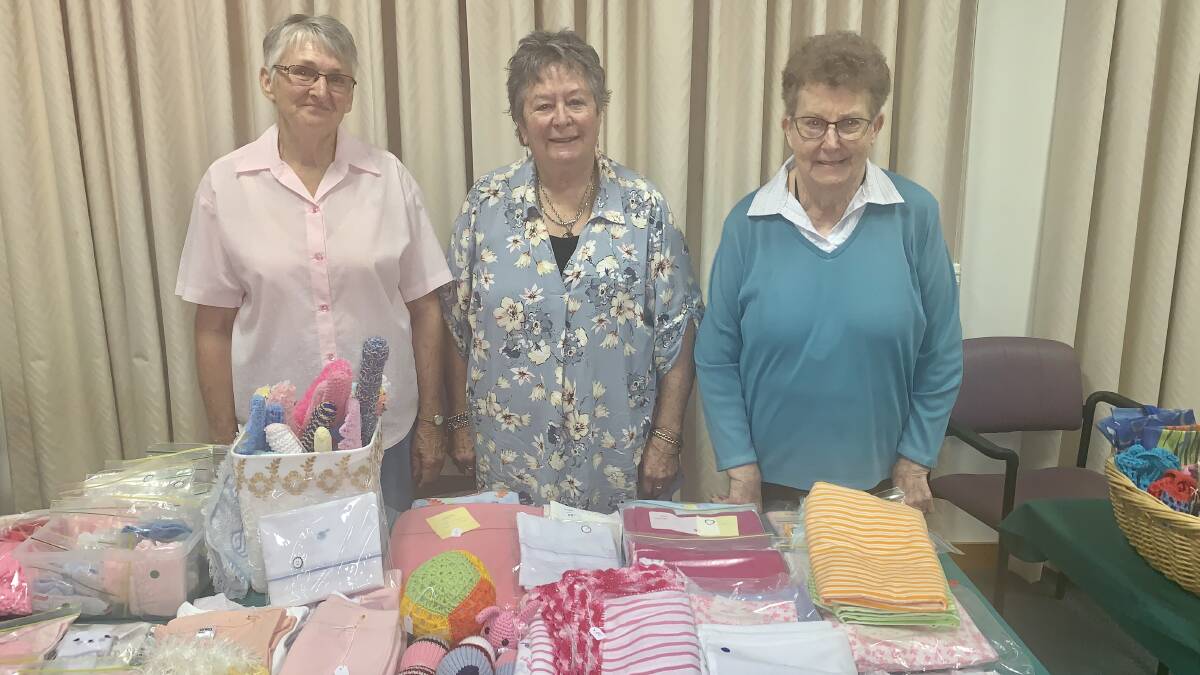 HOMEMADE ITEMS: Nazareth House auxiliary volunteers from left, Ethel Sevil, Melita Bartlett and Mary Camden prepare for the fete. An added attraction this year will be a performance from the Tamworth Pipe Band.