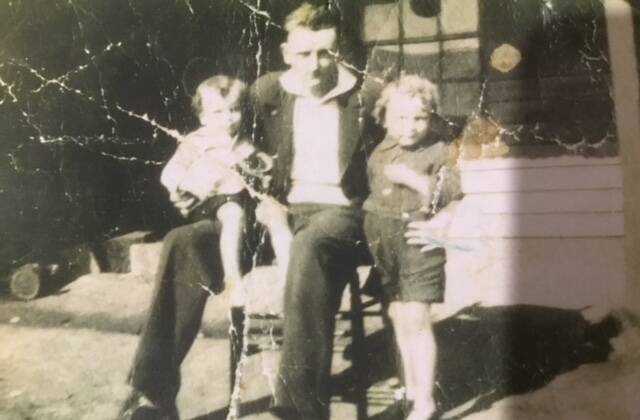Little Harold on big brother George's lap and little Donald Gordon Buckley standing. He was about four years of age when the photo was taken.