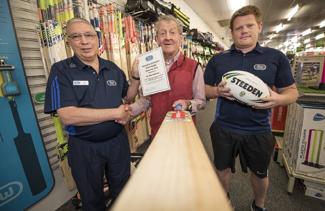 Recognise: Bob Barber and Ricky Craig congratulate Mike Cashman with the Sportsman's Warehouse Volunteer of the Month Award. Photo: Peter Hardin 141016