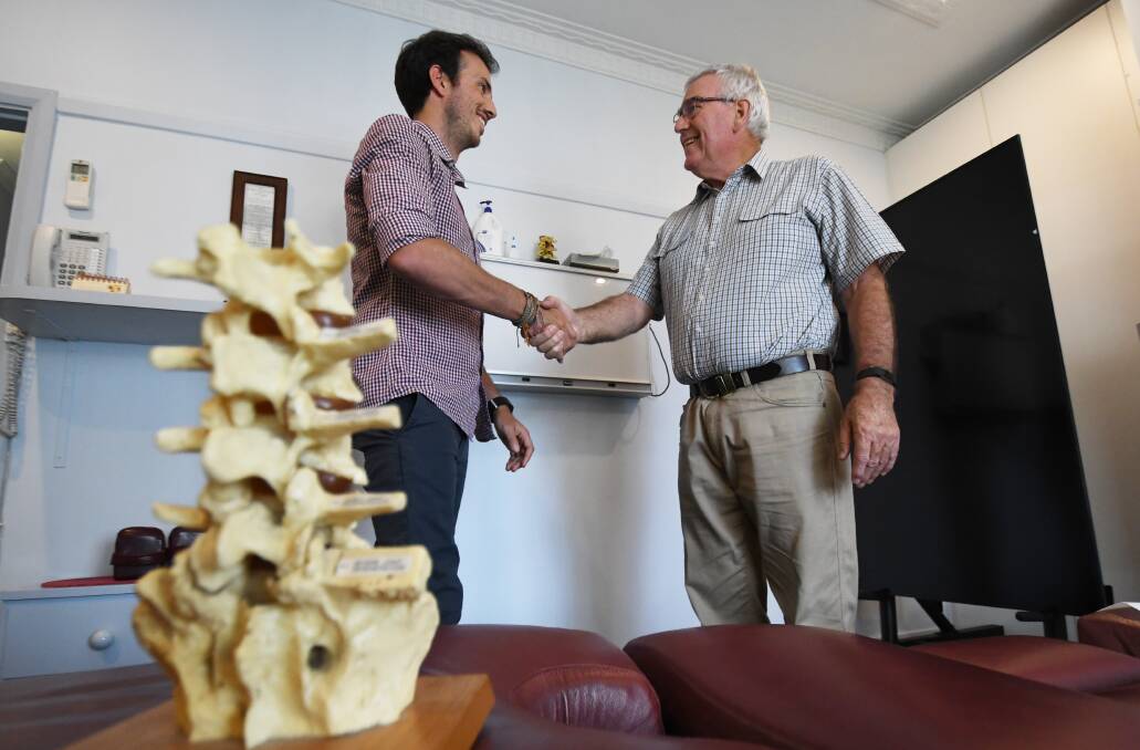 No bones about it: Chiropractor Dave Taylor is happy to be leaving his patients in the safe hands of Sam Baldock. Photo: Gareth Gardner