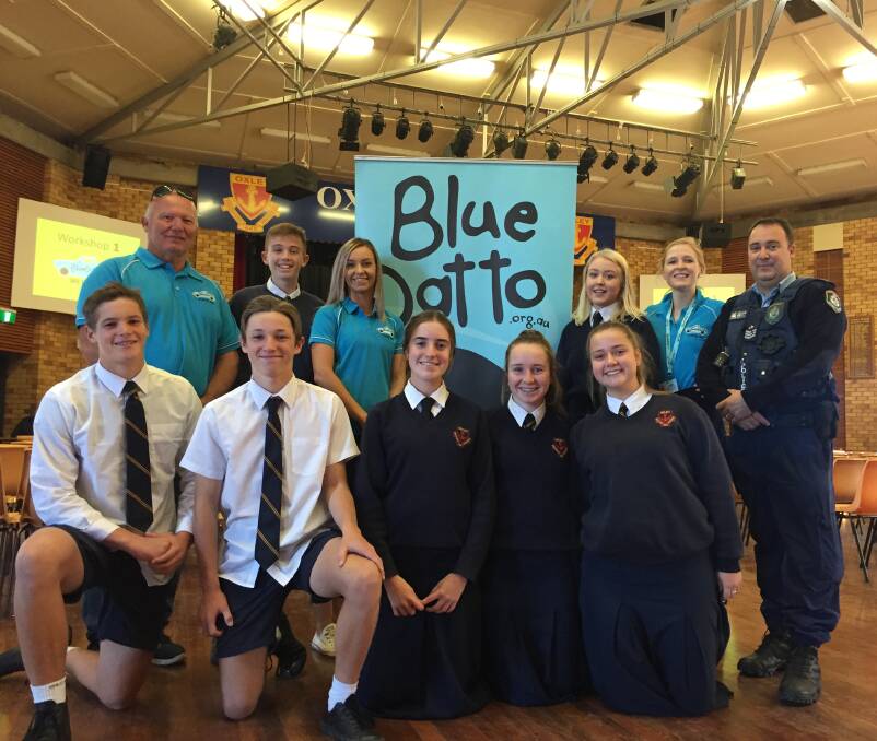Close to home: Joe Vassallo and the Blue Datto staff were joined by local police officer Sergeant Michael Buko at the Oxley High road safety day. Photo: Chris Bath
