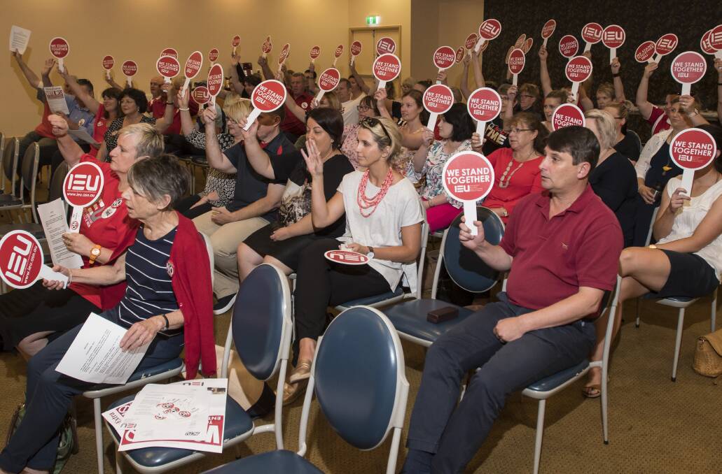 Pencils down: Catholic teachers and support staff in Tamworth at a stop work meeting in Tamworth during workplace agreement negotiations. Photo: Peter Hardin