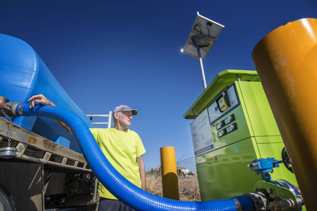 No rain gain: Water on the Run's Geoff Silvey is working seven days a week filling tanks, although thankfully the new automated water filling station has knocked over an hour out of his work day. Photo: Peter Hardin