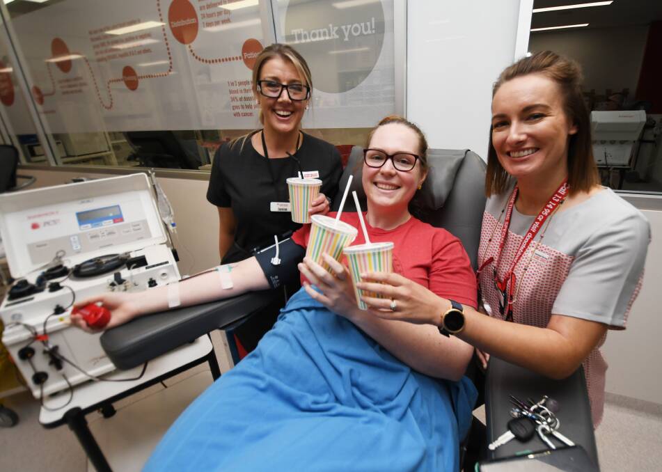 Win win: Jazmin Wills exchanging some plasma for a thick shake and cake at the Blood Service's Biggest Morning Tea. Photo: Gareth Gardner 230519GGC02