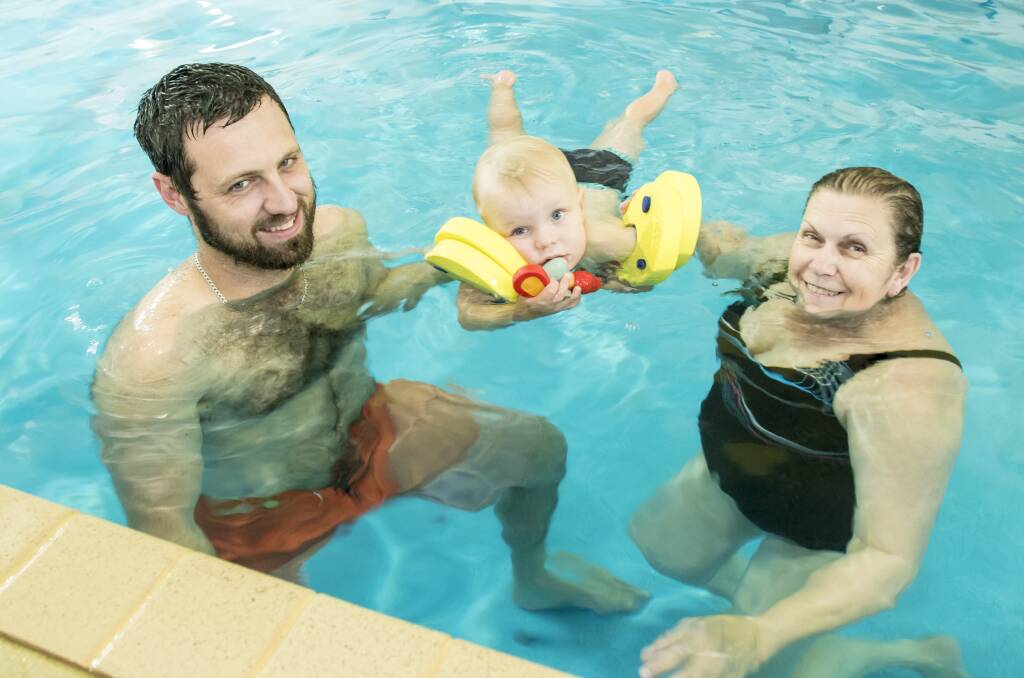 Life skill: Chris and Sebastian Skilton getting ready for the Summer months by learning an important life skill with Austswim instructor Ann Schultz at Tamworth Learn to Swim. Photo: Peter Hardin
