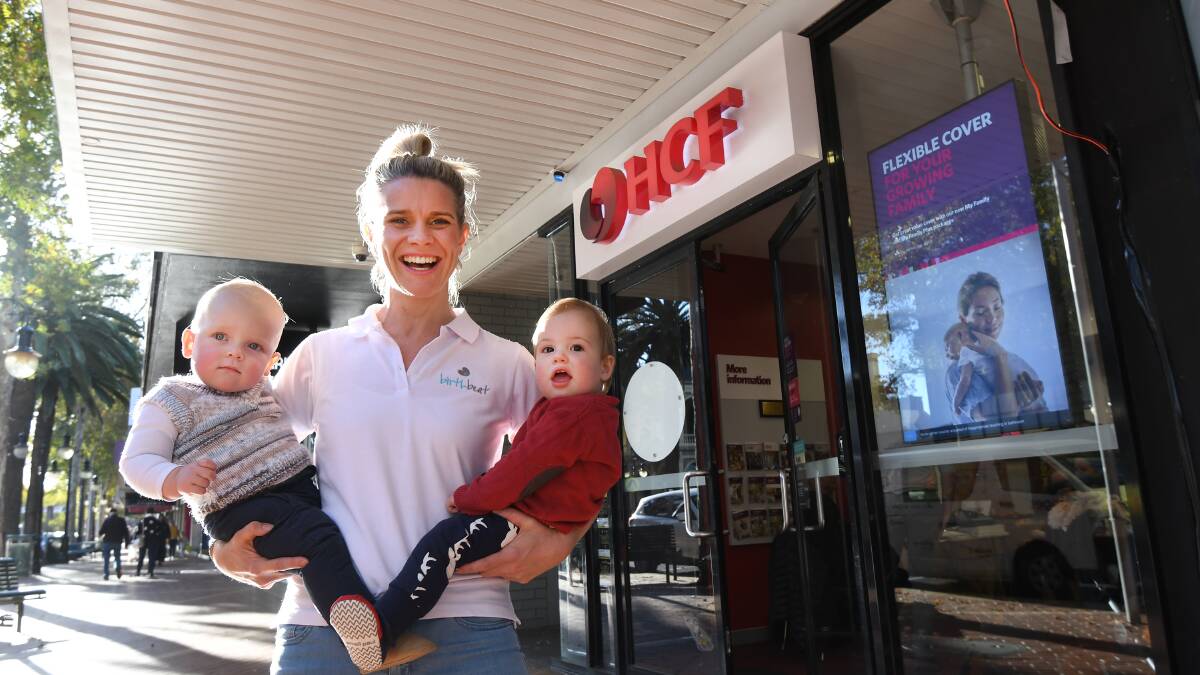Pride and passion: Birth Beat founder and Tamworth local Edwina Sharrock with Nixon Branley and Jaxon Smith after signing a deal to put her business in packages offered by health fund giants HCF. Photo: Gareth Gardner 