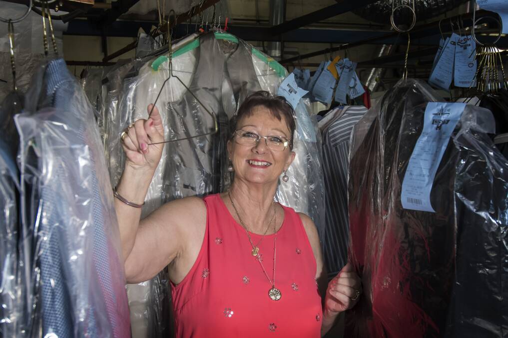 The final hanger: Robyn Daley has hung her last coat hanger at Central Dry Cleaners, and is looking forward to her retirement after 29 years and one day on the job. Photo: Peter Hardin 040118