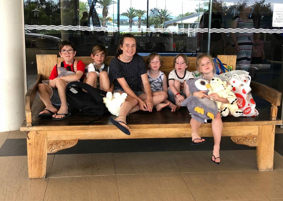 Tired smiles: The Rodda children were "exhausted but so happy" following a 2070km round trip to the Gold Coast courtesy of the Kyle and Jackie O Show.