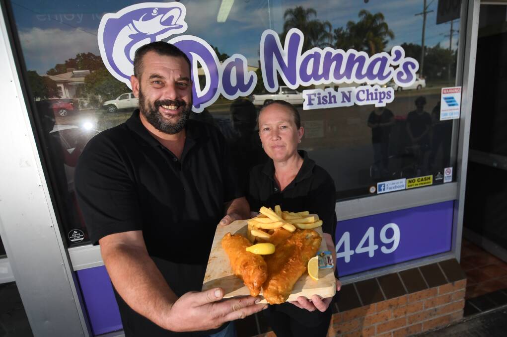 Top catch: Graeme and Laurel Wernhard with the signature Da Nanna's barramundi and chips at their new Robert Street store. Photo: Gareth Gardner 200519