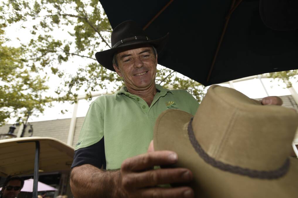 Crowds brimming: Ozhatz Akubra vendor Bruce Gould doesn't believe the heat will have any impact on trade as the crowds continue to roll into town. Photo: Ben Jaffrey
