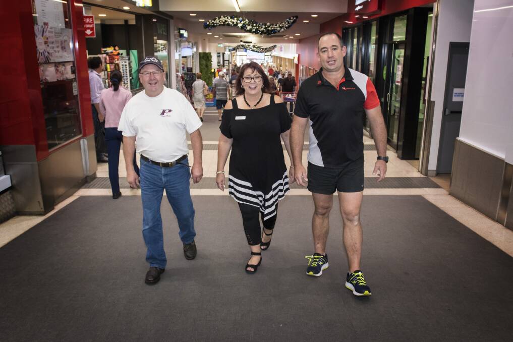 Walk right in: Brian Penrose, Julie Crosby and Paul Lawrence all recorded positive feedback from the $1 million promotion in their respective stores. Photo: Peter Hardin