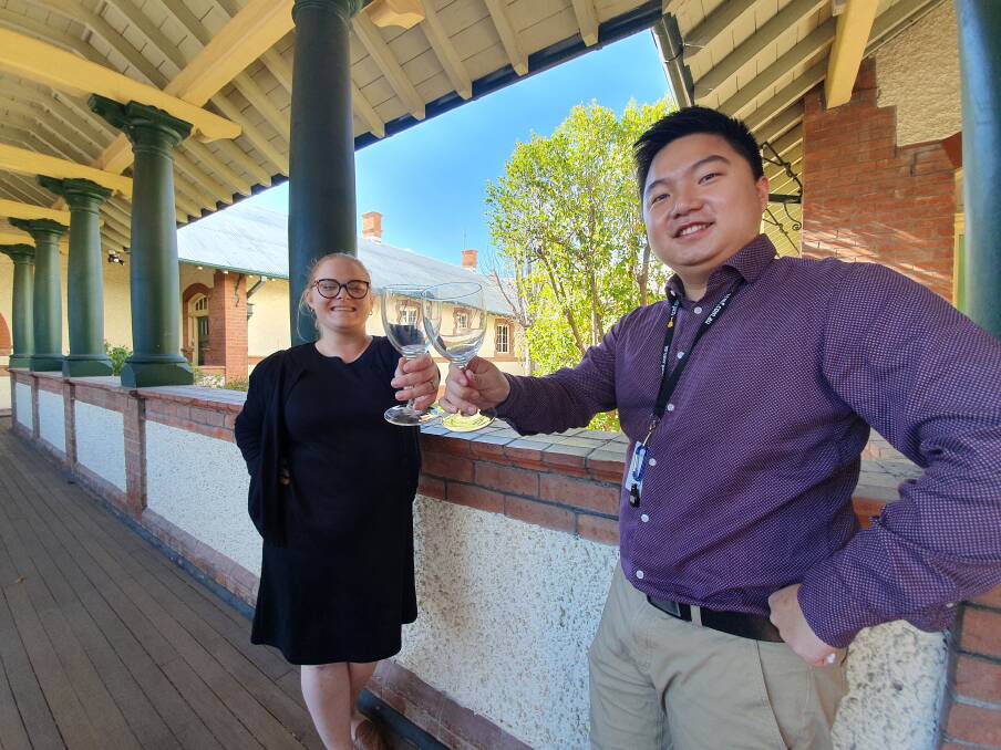 Cheers: Junior Business Chamber committee members Tamara Ferguson and Alex Wang are hosting a Wine and Dine event at Merilba Estate this Saturday. Photo: Chris Bath