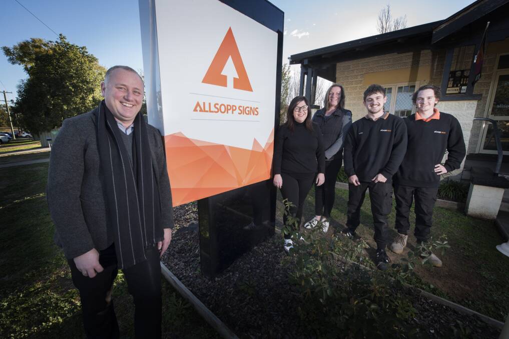 First in: Jye Segboer was the first to congratulate Allsopp Signs who have been named a finalist for the second year straight. Photo: Peter Hardin 180719PHF003