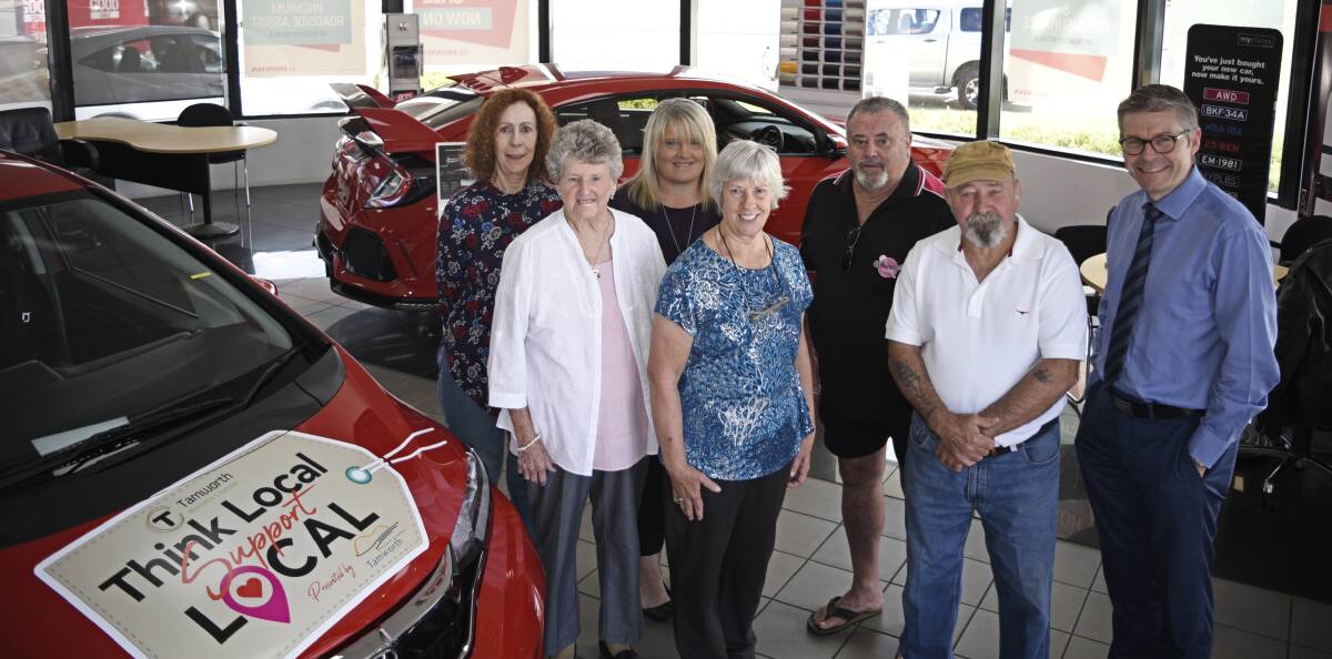 Start your engine: Six of the lucky key winners check out their could-be new wheels alongside Mark Woodley. Photo: Ben Jaffrey