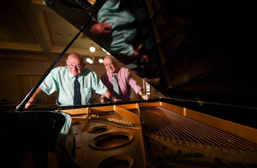 Two men never again: Bill Gleeson and Richard Hutt have raised over $500,000 since taking over the piano at the Mayfair Hotel in 1982. Photo: Gareth Gardner