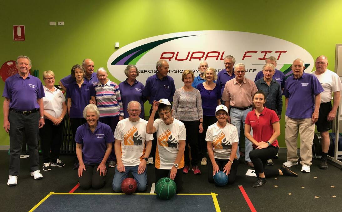 Give it a good shake: John and Jenni Fergus and Eileen Fleming flanked by the Movers, Sippers and Shakers group as they train for the El Camino at Rural Fit.